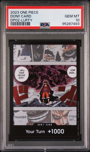 One Piece trading card with Luffy in a dark outfit, framed by comic book panels and text, graded Gem MT 10 by PSA.